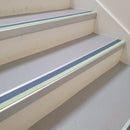 72x55mm aluminium stair nosing with a Cobalt Blue PVC insert and green photoluminescent strip fitted to leisure centre stairs