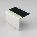 72mm tread by 55mm riser aluminium stair nosing shown on its own, deep square riser leg, black PVC insert and green photoluminescent nose strip