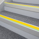 72x55mm aluminium stair nosing with a yellow PVC insert and green photoluminescent strip fitted to communal housing stairs