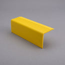 Yellow PVC stair nosing 50mm x 42mm shown alone on a plain studio background, ribbed tread face and full-depth front face visible