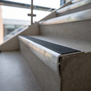 PVC Stair Nosing 67mm Tread Straight Edge Ramped Profile professionally fitted in use