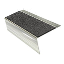 Bright Polished rake back DDA aluminium stair nosing 70 x 56mm with Obsidian black High Grip insert, studio view showing the raked leg and ramped back