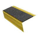 Mirrorflect Gold rake back DDA aluminium stair nosing 70 x 56mm with Obsidian black High Grip insert, studio view showing the raked leg and ramped back