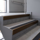 Aluminium rake back stair nosing 56 x 56mm, Coal Exterior Grip insert, Dark Bronze finish, fitted to concrete steps
