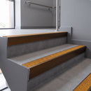 Aluminium rake back stair nosing 56 x 56mm, Solar Mor Grip insert, Dark Bronze finish, fitted to concrete steps