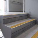 Aluminium rake back stair nosing 56 x 56mm, Brimstone Exterior Grip insert, Mill Finish, fitted to concrete steps