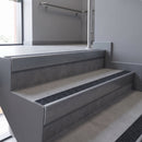 Aluminium rake back stair nosing 56 x 56mm, Coal Exterior Grip insert, Mill Finish, fitted to concrete steps