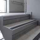Aluminium rake back stair nosing 56 x 56mm, Obsidian Mor Grip insert, Mill Finish, fitted to concrete steps