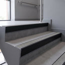 Aluminium rake back stair nosing 56 x 56mm, Everest Exterior Grip insert, Satin Black finish, fitted to concrete steps