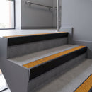 Aluminium rake back stair nosing 56 x 56mm, Solar Mor Grip insert, Satin Black finish, fitted to concrete steps