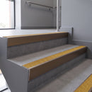 Aluminium rake back stair nosing 56 x 56mm, Brimstone Exterior Grip insert, Satin Bronze finish, fitted to concrete steps