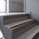 Aluminium rake back stair nosing 56 x 56mm, Coal Exterior Grip insert, Satin Bronze finish, fitted to concrete steps