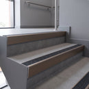 Aluminium rake back stair nosing 56 x 56mm, Obsidian Mor Grip insert, Satin Bronze finish, fitted to concrete steps