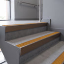 Aluminium rake back stair nosing 56 x 56mm, Solar Mor Grip insert, Satin Bronze finish, fitted to concrete steps
