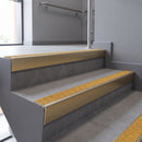 Aluminium rake back stair nosing 56 x 56mm, Brimstone Exterior Grip insert, Satin Gold finish, fitted to concrete steps