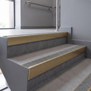 Aluminium rake back stair nosing 56 x 56mm, Everest Exterior Grip insert, Satin Gold finish, fitted to concrete steps