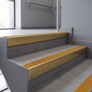 Aluminium rake back stair nosing 56 x 56mm, Solar Mor Grip insert, Satin Gold finish, fitted to concrete steps