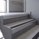Aluminium rake back stair nosing 56 x 56mm, Coal Exterior Grip insert, Satin Silver finish, fitted to concrete steps