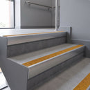 Aluminium rake back stair nosing 56 x 56mm, Solar Mor Grip insert, Satin Silver finish, fitted to concrete steps