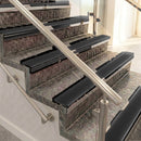 Raked back aluminium stair nosing, black anodised with black smooth textured insert