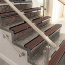 Raked back aluminium stair nosing, black anodised with claret castellated insert