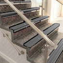 Raked back aluminium stair nosing, black anodised with flint castellated insert