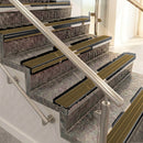 Raked back aluminium stair nosing, black anodised with olive castellated insert
