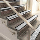 Raked back aluminium stair nosing, black anodised with polar grey castellated insert