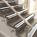 Raked back aluminium stair nosing, black anodised with polar grey smooth textured insert