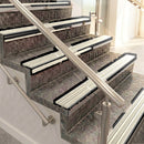 Raked back aluminium stair nosing, black anodised with porth stone castellated insert