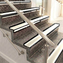Raked back aluminium stair nosing, black anodised with porth stone smooth textured insert