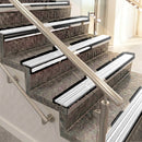 Raked back aluminium stair nosing, black anodised with white castellated insert