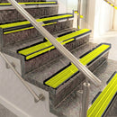 Raked back aluminium stair nosing, black anodised with yellow castellated insert
