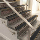 Raked back aluminium stair nosing, bronze with black smooth textured insert