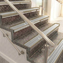 Raked back aluminium stair nosing, light bronze with light grey castellated insert
