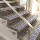 Raked back aluminium stair nosing, light bronze with nimbus castellated insert