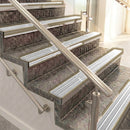 Raked back aluminium stair nosing, light bronze with polar grey castellated insert