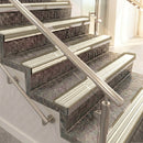 Raked back aluminium stair nosing, light bronze with porth stone castellated insert