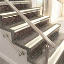 Raked back aluminium stair nosing, light bronze with porth stone smooth textured insert