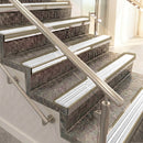 Raked back aluminium stair nosing, light bronze with white castellated insert