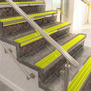 Raked back aluminium stair nosing, light bronze with yellow castellated insert