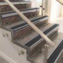 Raked back aluminium stair nosing, mill aluminium with black castellated insert