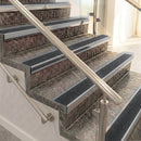 Raked back aluminium stair nosing, mill aluminium with black olympic grip insert