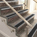 Raked back aluminium stair nosing, mill aluminium with black smooth textured insert