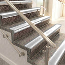 Raked back aluminium stair nosing, mill aluminium with polar grey smooth textured insert