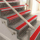 Raked back aluminium stair nosing, mill aluminium with poppy castellated insert