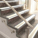 Raked back aluminium stair nosing, mill aluminium with porth stone smooth textured insert
