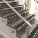 Raked back aluminium stair nosing, polished aluminium with black castellated insert