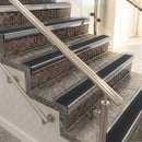 Raked back aluminium stair nosing, polished aluminium with black smooth textured insert