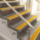 Raked back aluminium stair nosing, polished aluminium with gold castellated insert